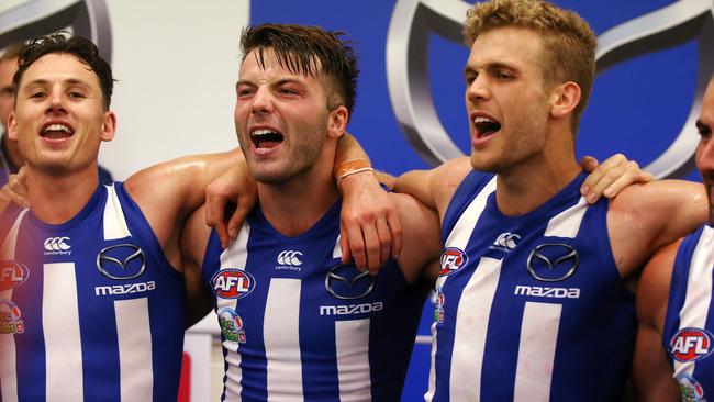 Luke McDonald (second from left) sings the club song after North Melbourne’s win over St Kilda. Picture: Michael Klein