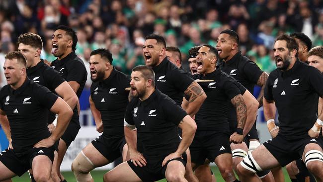 New Zealand players perform the haka ahead of the France 2023 Rugby World Cup quarter-final match between Ireland and New Zealand at the Stade de France in Saint-Denis, on the outskirts of Paris, on October 14, 2023. (Photo by Anne-Christine POUJOULAT / AFP)