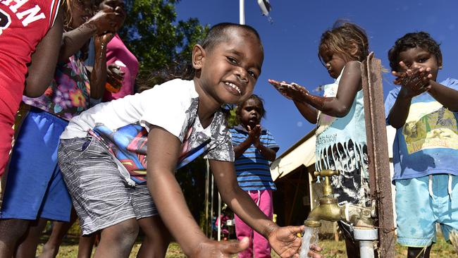 Children from Borroloola wash their hands – all part of the daily routine at IndiKindi. Picture: Wayne Quilliam