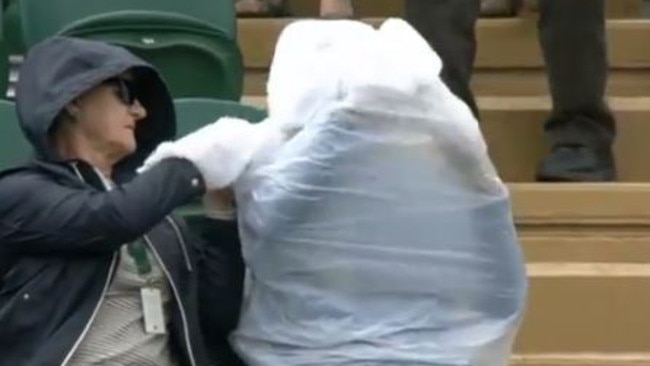 At one point his entire upper-half was consumed by the protective raingear. Image: BBC