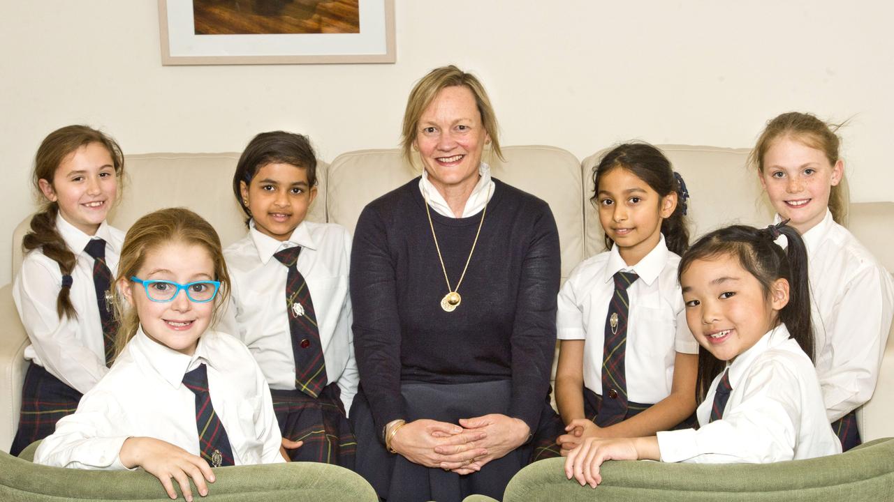 Dr Linda Evans photographed with Fairholme students (from left) Amelia Beattie, Richa Vimal, Sandili Phaltane, Lucy Williams, (front from left) Gracie Walker and Alicia Yap in 2018.