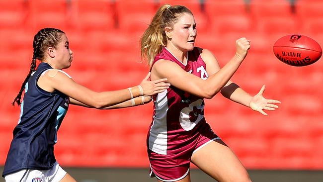 Alana Gee of Queensland handballs during the Under 18 Girls Championship match between Queensland and Vic Metro at Metricon Stadium on April 19, 2022 in Gold Coast, Australia. Picture: Chris Hyde/AFL Photos