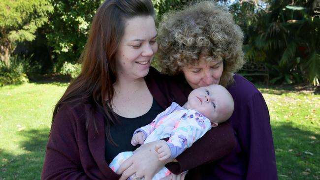 Tegan O'Brien, baby Rua and Jan Catterall. Picture: Adam Ward