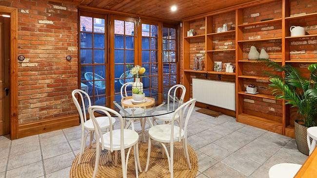 The open-plan kitchen overlooks a casual family and meals area.