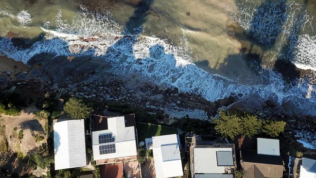 Aerial view of the destruction to homes along Ocean View Dr in Wamberal after large waves undermined their foundations over the last week. Picture: Jonathan Ng