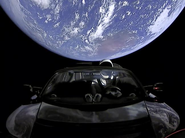 This image from video provided by SpaceX shows the company's spacesuit in Elon Musk's red Tesla sports car which was launched into space during the first test flight of the Falcon Heavy rocket on Tuesday, Feb. 6, 2018. (SpaceX via AP)