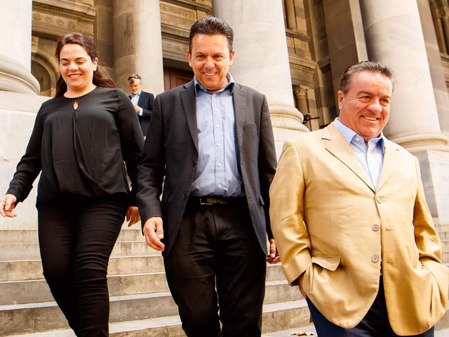 SA Best leader Nick Xenophon (centre) with candidates Connie Bonaros (left) and Frank Pangallo (right) outside SA Parliament.