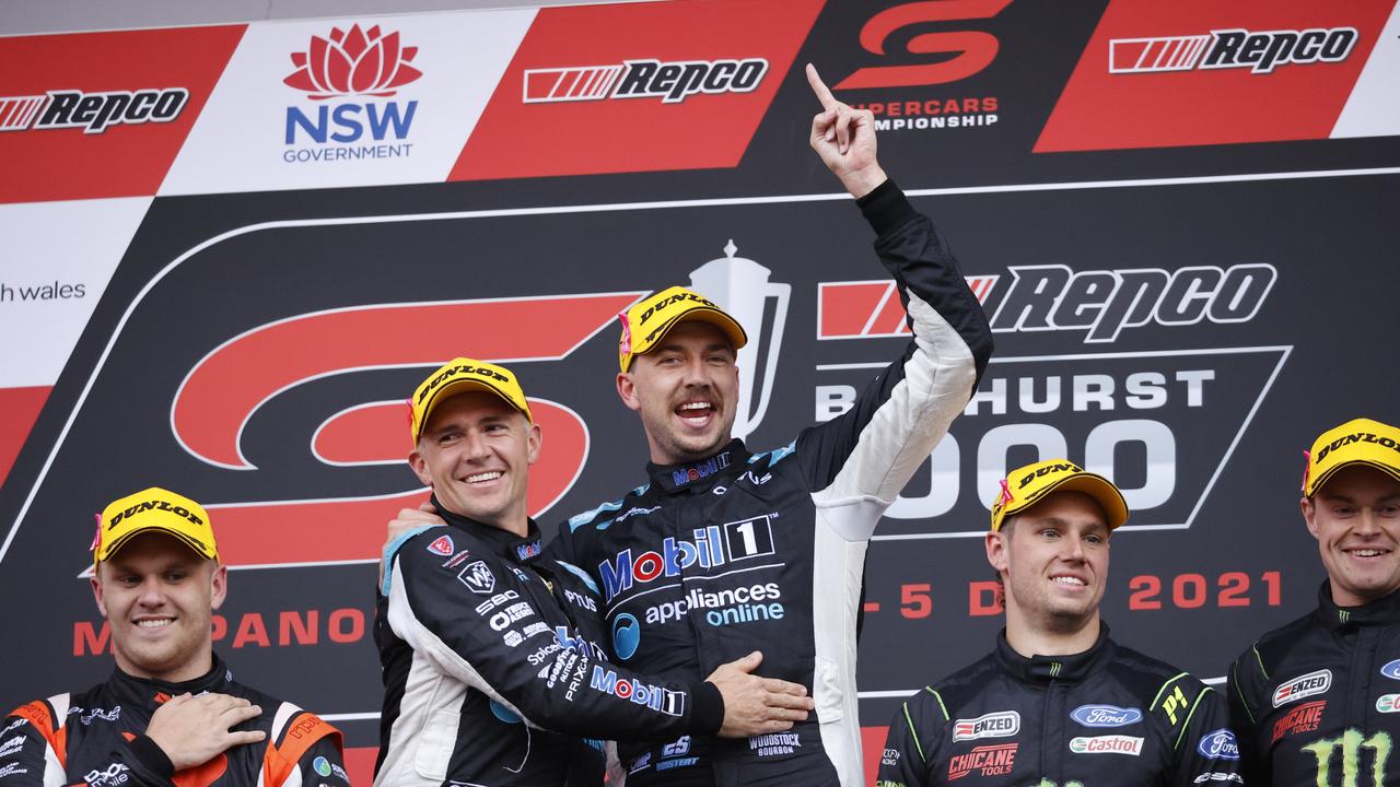 DAILY TELEGRAPH. DECEMBER 5, 2021. Pictured is Lee Holdsworth and Chaz Mostert celebrating on the podium after winning the Repco Bathurst 1000 at Mount Panorama today. Picture: Tim Hunter.