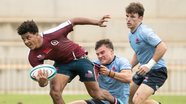 Waratah’s gun Marshall Le Maitre tackles the Reds fullback. Picture: Julian Andrews