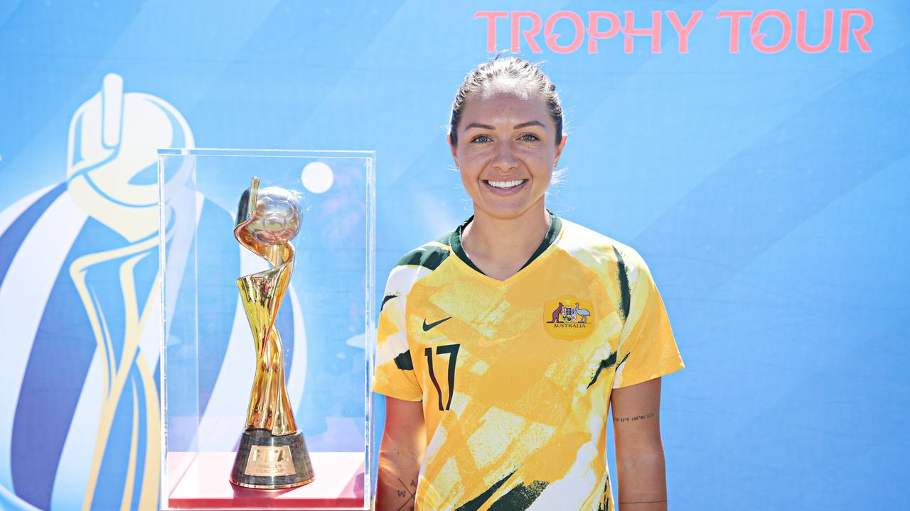 Kyah Simon poses with the World Cup - which Australia will host in 2023. Photographer: Adam Yip