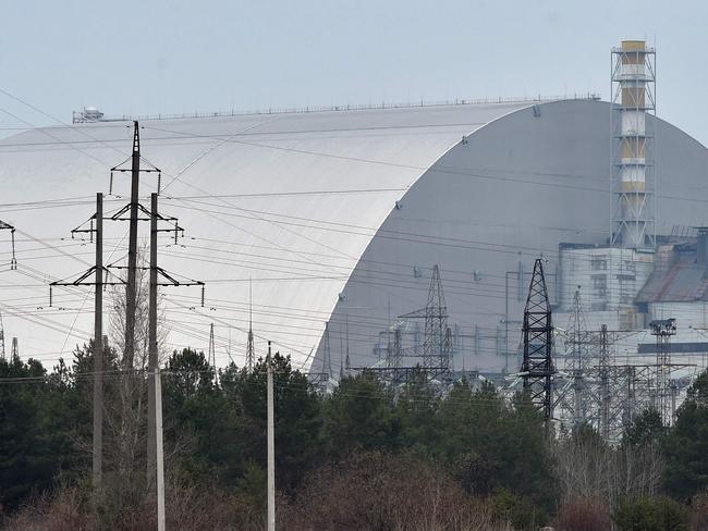 (FILES) A file picture taken on April 13, 2021 shows the giant protective dome built over the sarcophagus covering the destroyed fourth reactor of the Chernobyl Nuclear Power Plant ahead of the upcoming 35th anniversary of the Chernobyl nuclear disaster. - Ukraine's Chernobyl nuclear plant says 'completely halted' over Russian offensive. (Photo by Sergei SUPINSKY / AFP)