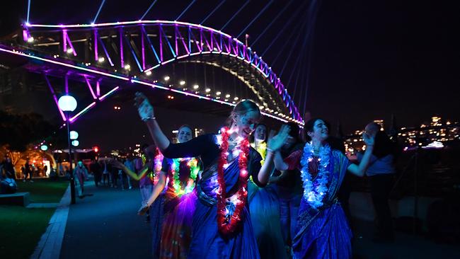 ‘Let’s pursue more street activations, arts and cultural events – rally behind events like Vivid in Sydney but make sure we have an all-year-round calendar.’ Dancing at Sydney’s Circular Quay on the autumn-winter Vivid opening night in pre-pandemic 2019. Picture: AAP