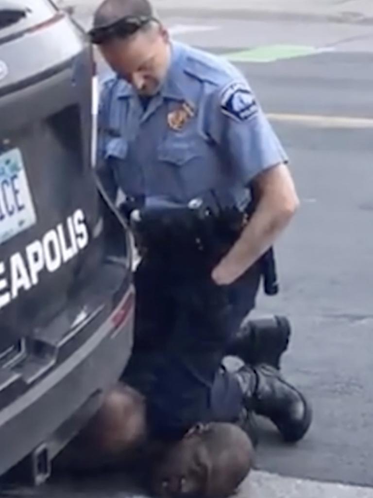 A Minneapolis officer kneels on the neck of George Floyd, a handcuffed man who was pleading that he could not breathe. Picture: AP