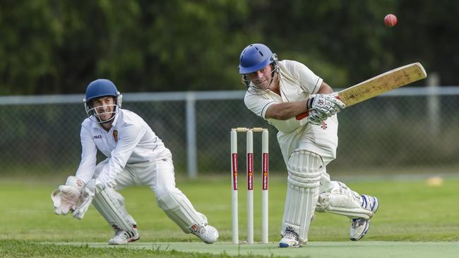 Delacombe Park keeper Johnny Guthrie and Red Hill captain coach Simon Dart in action.