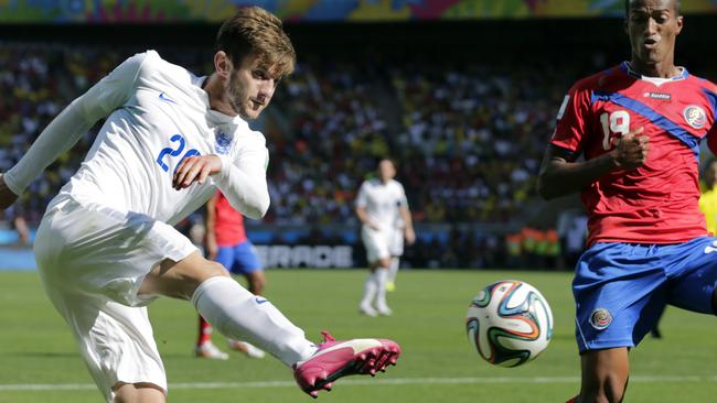 England's Adam Lallana kicks a cross as Costa Rica's Roy Miller defends during the group D World Cup soccer match between Costa Rica and England at the Mineirao Stadium in Belo Horizonte, Brazil, Tuesday, June 24, 2014. (AP Photo/Fernando Vergara)