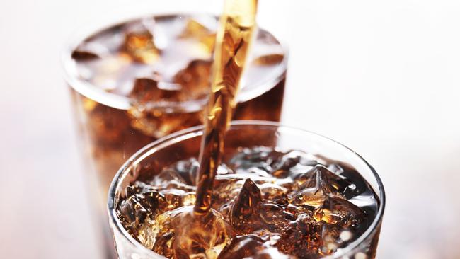 soft drink being poured into glass