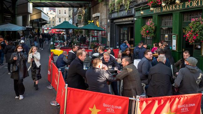 After-work drinkers enjoy a pint outside The Market Porter pub in Borough Market, London. Picture: AFP