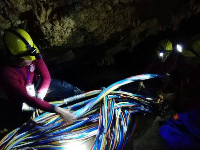 Rescue workers at the cave site. Picture: AFP