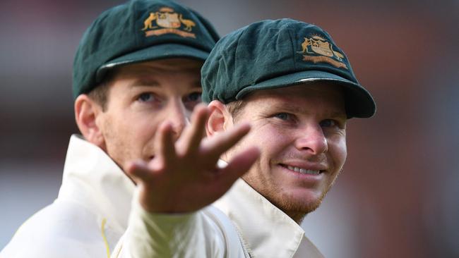 Australian captain Tim Paine (left) and his predecessor, Steve Smith, celebrate their Fourth Test victory at Old Trafford. Picture: AFP