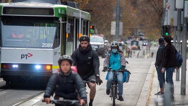 Drivers on Yarra Trams and Metro Trains have reported more crowded services, sick passengers and travellers standing far too close to each other. Picture: Tony Gough