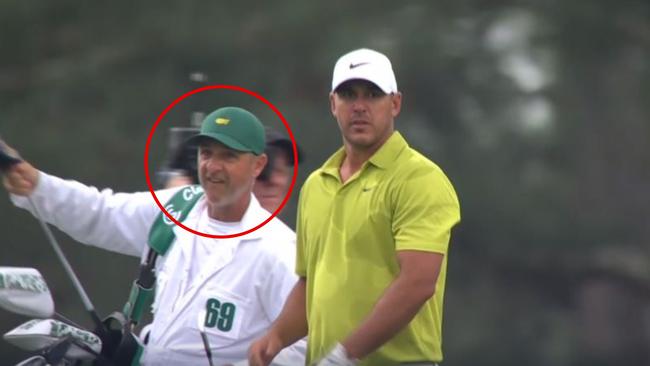 Brooks Koepka’s caddie appears to mouth the word “five” in the direction of another player’s caddie.