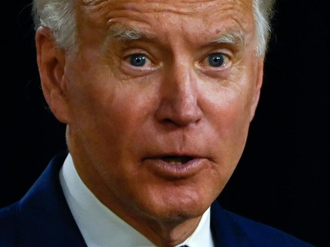 US Presidential candidate and former Vice President, Joe Biden holds a pad with potential Vice Presidential names on it and other notes, during a campaign event at the William "Hicks" Anderson Community Center in Wilmington, Delaware on July 28, 2020. (Photo by ANDREW CABALLERO-REYNOLDS / AFP)