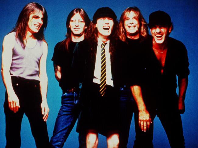 Rock band AC/DC members Angus Young with Brian Johnson, Cliff Williams, Malcolm Young and Phil Rudd.