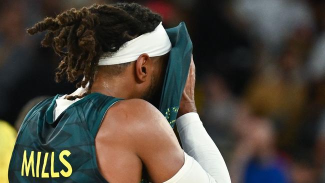 Australia's #05 Patty Mills reacts after the men's quarterfinal basketball match between Serbia and Australia during the Paris 2024 Olympic Games at the Bercy  Arena in Paris on August 6, 2024. (Photo by Aris MESSINIS / AFP)