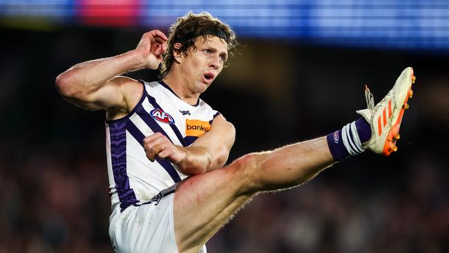 MELBOURNE, AUSTRALIA - JULY 01: Nat Fyfe of the Dockers kicks the ball during the 2023 AFL Round 16 match between the Western Bulldogs and the Fremantle Dockers at Marvel Stadium on July 1, 2023 in Melbourne, Australia. (Photo by Dylan Burns/AFL Photos via Getty Images)