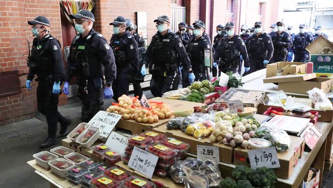 Police on patrol at the popular market. Picture: David Crosling