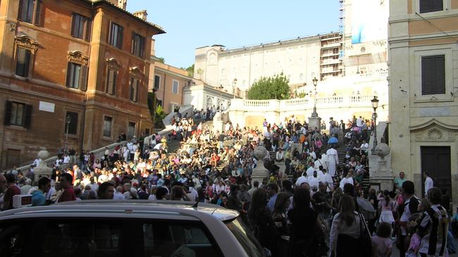 The Spanish Steps in Rome, made famous after they featured in Roman Holiday, attracted so many visitors that the Italian government had to make it illegal to sit on them. Picture: News Corp