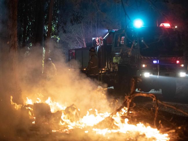 The fire is monitored as it burns. Picture: Liam Mendes