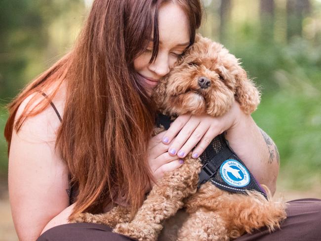 Autistic, disabled, Sunshine Coast woman, Grace Garrahy, says service dog saved her from suicide. Picture - contributed.