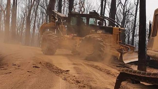 Brett Robin's crew clearing dangerous trees and roads at Mallacoota in the wake of the 2019-20 black summer fires.