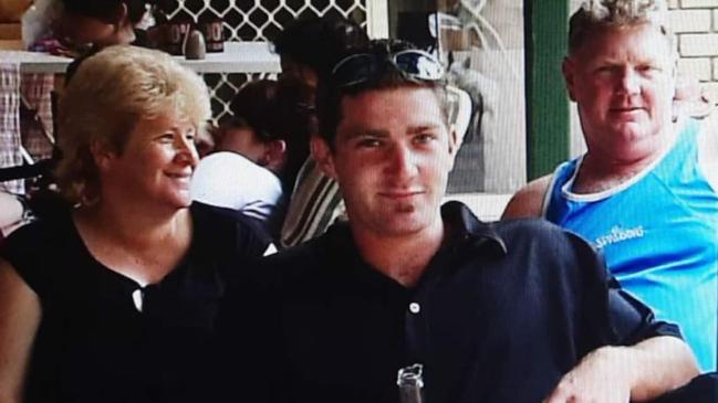 Scott Kevill (middle) with his mum Cathy and dad Stephen.