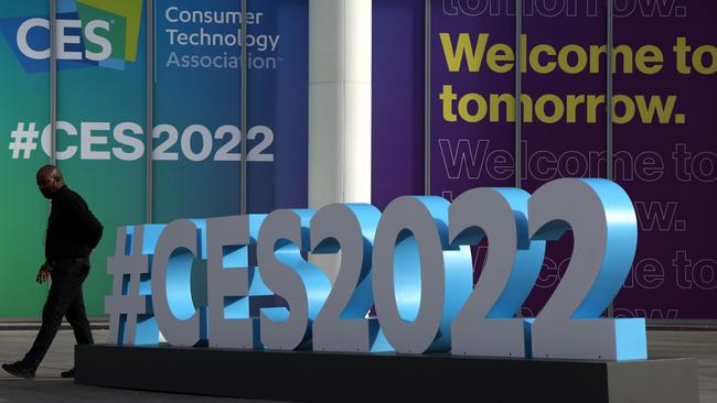 A man passes by signs of CES 2022 outside the Las Vegas Convention Centre. Picture: AFP