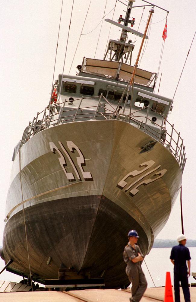 Australian Navy patrol boat HMAS Gawler in 1998 after being stuck in mid-air while being lowered into water by lifting platform in Darwin.
