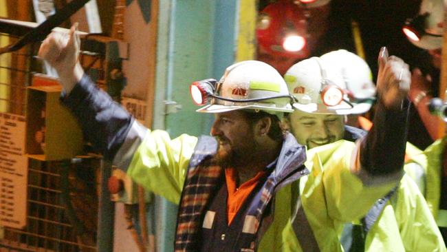 Tasmanian miners Todd Russell and Brant Webb emerge from the mine lift having been rescued after being trapped underground at Beaconsfield gold mine for 14 days in 2006. Picture: IAN WLADIE/GETTY