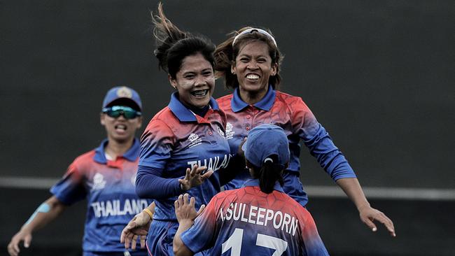 Thailand’s Chanida Sutthiruang celebrates with teammates after taking a wicket against the West Indies. Picture: AFP