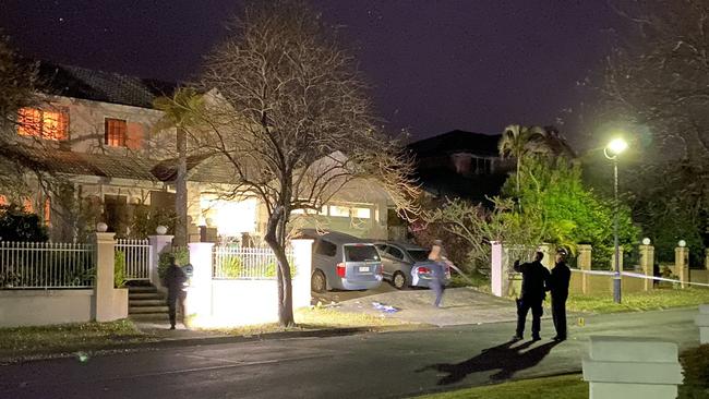 Police at the scene of a shooting at Stretton on Sunday night. Picture: Twitter/9 News