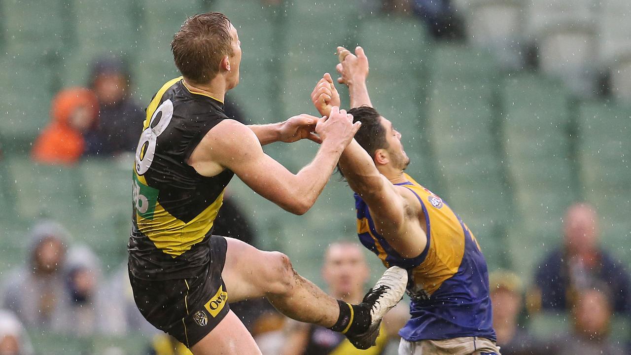 Richmond’s Jack Riewoldt was penalised for these free kicks against Eagle Tom Barrass. Picture: Michael Klein