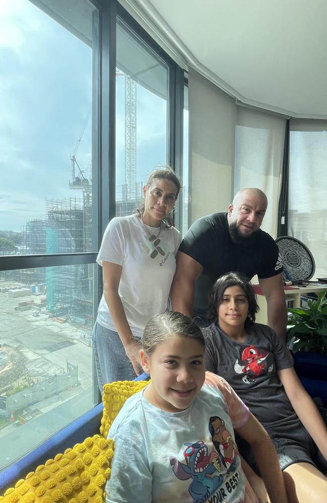 Heba Aly, her husband Mouhamad Dehen and their children Maryam and Yusuf in their Wentworth Point apartment. Wentworth Point High School is under construction across the road.