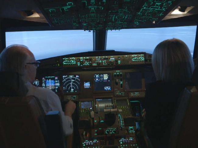 Senior Boeing 777 pilot and instructor Simon Hardy and reporter Tara Brown in a flight simulator for a story about MH370 on 60 Minutes.