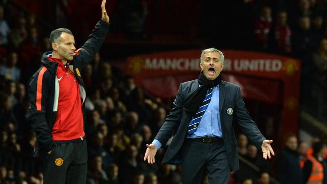 Jose Mourinho (R) complains alongside Ryan Giggs.