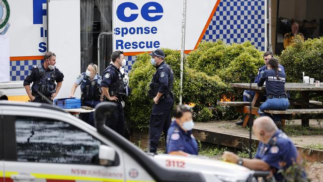 Emergency crews convene at a command post on Saturday. Picture: Tim Hunter