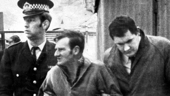 Convicted murderer Clifford Bartholomew (centre) being escorted by police. Picture: File