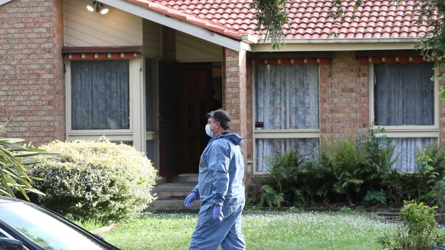 Forensic investigators at the home in Bayswater North. Picture: David Crosling