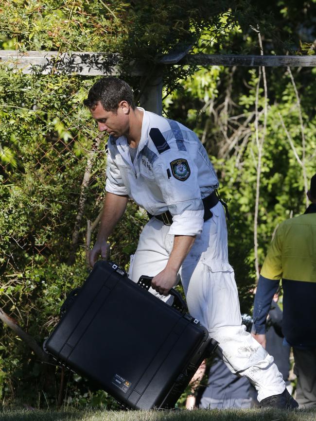 Police forensics bring in testing equipment. Picture: David Swift