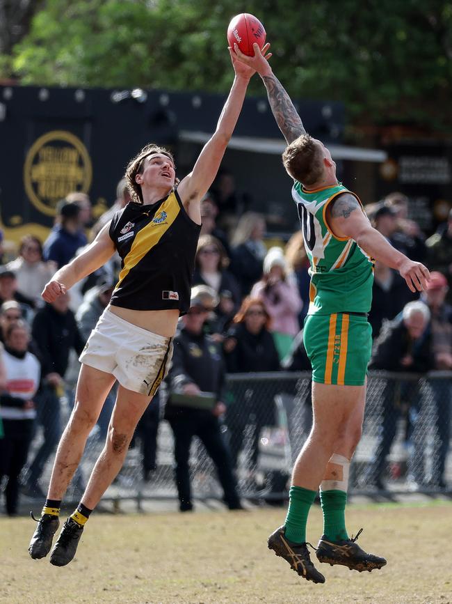 EFL: Tom Lovell of Mitcham and Mooroolbark’s Ryley Monkhorst. Picture: George Salpigtidis