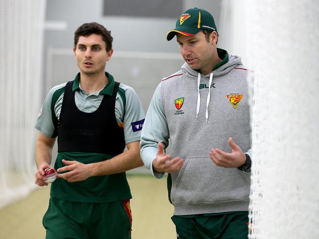 Adam Griffith, right, at work in the nets with Tigers all-rounder Simon Milenko. Picture: SAM ROSEWARNE